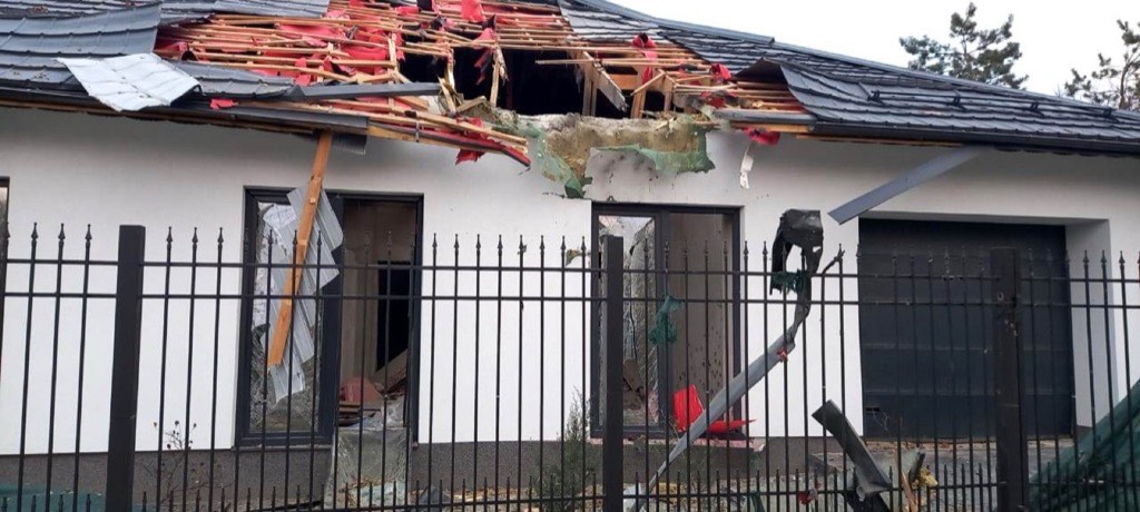 A family home in Kherson with its roof torn open and walls shredded by shrapnel after a Russian strike.