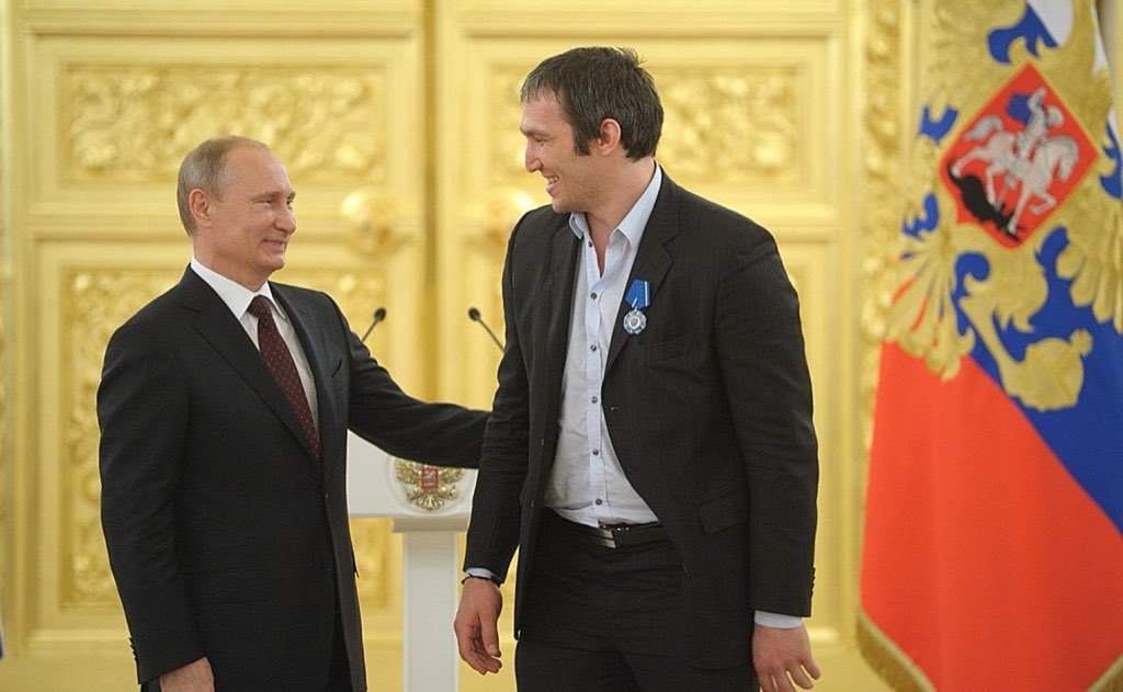 Alex Ovechkin shaking hands with Vladimir Putin at a Kremlin state award ceremony.